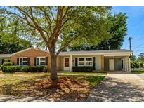 Charming single-story home featuring a brick facade, well-maintained landscaping, and a convenient carport at 617 Hibiscus Ave. # 617, Myrtle Beach, SC 29577