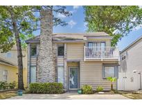 Charming two-story home featuring a brick chimney and an outdoor balcony at 829 9Th Ave. S, North Myrtle Beach, SC 29582