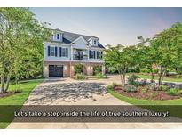 Charming raised beach house with a well-manicured lawn and a spacious driveway at 130 Hagar Brown Rd., Murrells Inlet, SC 29576