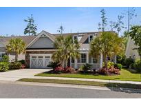 Charming single-Gathering home with stone accents, lush landscaping, and a welcoming front porch at 1470 Suncrest Dr., Myrtle Beach, SC 29577