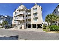 Beautiful three-story condo with balconies and covered parking, close to the beach and nearby attractions at 156 Via Old Sound Blvd. # C, Ocean Isle Beach, NC 28469