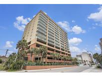 Spacious condo building exterior with multiple floors and balconies overlooking beautifully landscaped surroundings at 1707 Perrin Dr. # 802, North Myrtle Beach, SC 29582
