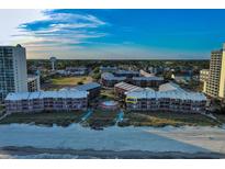 Beautiful aerial view of an ocean-front condo building with beach access and community pool at 208 N Ocean Blvd. # 321, North Myrtle Beach, SC 29582