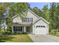 Charming two-story home with a one car garage and a beautifully landscaped front yard at 215 Carolina Farms Blvd., Myrtle Beach, SC 29579