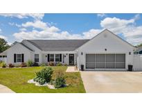 Charming single-story home featuring a well-manicured lawn and a two-car garage at 2506 Berleze Ct., Conway, SC 29527
