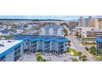 Coastal condo building featuring balconies with views of the beach and waterway at 6001 N Ocean Blvd. # 240, North Myrtle Beach, SC 29582