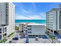 Beautiful ocean view from a condo in a building with parking and other amenities at 1011 S Ocean Blvd. # 202, North Myrtle Beach, SC 29582