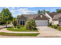 Charming one-story home with a well-maintained lawn and attached two-car garage at 1129 Prescott Circle, Myrtle Beach, SC 29577