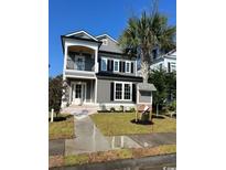 Charming two-story home with gray siding, white trim, and a small front yard at 1348 Rue De Jean Ave., Myrtle Beach, SC 29579