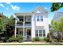 Charming two-story home featuring a welcoming porch and manicured landscaping at 1359 Peterson St., Myrtle Beach, SC 29577