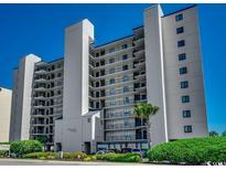 The Beach Club condo building featuring multiple balconies with ocean views and well-manicured landscaping at 3601 S Ocean Blvd. # 8-C, North Myrtle Beach, SC 29582