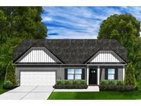 Charming single-story home featuring a covered entry, attached garage, and beautifully landscaped front yard at 4762 Huckleberry Ln., Conway, SC 29526