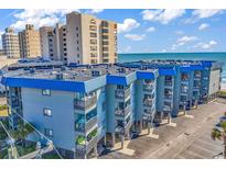 Coastal condo complex featuring private balconies with ocean views and on-site parking at 6000 N North Ocean Blvd. # 329, North Myrtle Beach, SC 29582