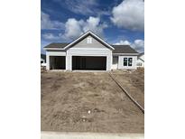 New construction single Gathering home with two car garage and partially sodded front yard at 907 Inlet Keys St., Murrells Inlet, SC 29576