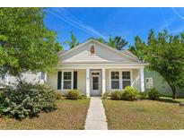 Charming single-story home with a well-manicured lawn, sidewalk, and inviting front porch at 908 Oglethorpe Dr., Conway, SC 29527