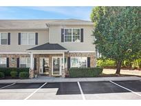Inviting two-story home featuring a covered entrance and well-maintained landscaping at 10970 Highway 90 # A5, Little River, SC 29566