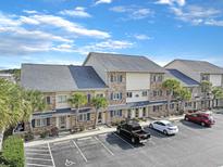 Well-maintained condo with parking and beautiful landscaping, perfect for comfortable coastal living at 205 Double Eagle Dr. # C-2, Myrtle Beach, SC 29575