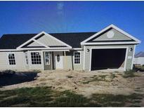 Charming single-story home with sage green siding, a modern garage, and a classic white front door at 2186 Mineral Springs Rd., Conway, SC 29527