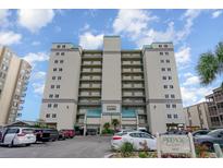 Low angle, full shot of the condominium building with parking in front and blue sky overhead at 2507 S Ocean Blvd. # 403, North Myrtle Beach, SC 29582