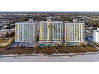 Stunning aerial view of a beachfront condo complex with multiple pools and easy beach access at 2701 S Ocean Blvd. # 1603, North Myrtle Beach, SC 29582