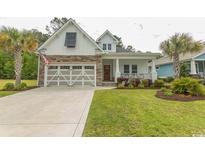 Charming single Gathering home featuring a stone and white siding, garage, and well-manicured lawn at 2928 Moss Bridge Ln., Myrtle Beach, SC 29579