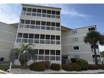 A beautiful shot of the exterior of the building showing multiple balconies and landscaping at 4350 Intercoastal Dr. # 2302, Little River, SC 29566