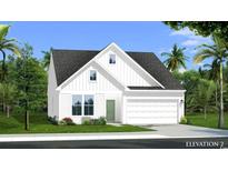 Charming two-story home with a two-car garage, white siding, green door, and a well-manicured lawn at 440 Sun Colony Blvd., Longs, SC 29568