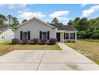 Charming single-story home with a well-manicured lawn and concrete driveway at 469 Overcrest St., Myrtle Beach, SC 29579
