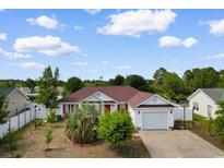Charming single story home with a well maintained lawn and attached garage at 761 Drawbridge Dr., Conway, SC 29526
