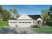 Beautiful home exterior with a three car garage and manicured lawn at 1061 Edenton Dr., Calabash, NC 28467