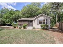 Charming single-story home features a screened porch and a well-maintained, shady front yard at 2206 Beck St., Georgetown, SC 29440