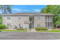 Condominium building with stairs and screened-in porches at 2312 Sweetwater Blvd. # 2312, Murrells Inlet, SC 29576