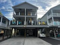 Charming coastal home featuring multiple balconies and covered parking perfect for beachside living at 6001 - Mh149B S Kings Hwy., Myrtle Beach, SC 29575