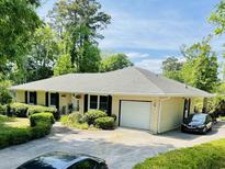 Charming single-story home with a well-manicured lawn, attached garage, and inviting curb appeal at 801 Talbot Circle, Myrtle Beach, SC 29577