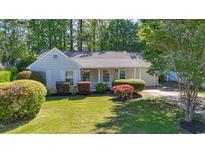 Charming single story home with mature landscaping and a welcoming front porch at 88 Purple Martin Dr., Murrells Inlet, SC 29576