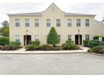 Charming townhome with neutral exterior, manicured landscaping, and convenient parking at 4532 Girvan Dr. # A, Myrtle Beach, SC 29579