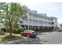 Beautiful exterior of a multi-story condo with parking in front of the building at 500 Wickham Dr. # 1070, Myrtle Beach, SC 29579