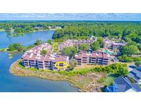 Waterfront condo with beautiful views of the lake and lush green landscape in a serene setting at 501 Maison Dr. # F8, Myrtle Beach, SC 29572