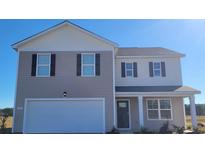 Two story home with a white garage door, neutral siding, black shutters and a porch at 528 Scarlet Sage Dr., Conway, SC 29527