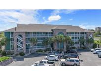 Beautiful exterior view of a multifamily home featuring stacked balconies and well-maintained landscaping at 806 Conway St. # 116, North Myrtle Beach, SC 29582