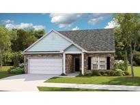 Charming single-Gathering home featuring stone accents, light blue shingle details and an attached two-car garage at 8719 Baton Rouge Ave Nw, Calabash, NC 28467