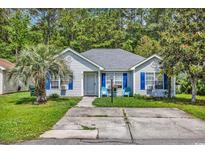 Charming single-story home with blue shutters and a well-maintained front yard at 9450 Leeds Circle, Myrtle Beach, SC 29588