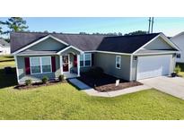 Charming single Gathering home with two-car garage, manicured lawn and attractive landscaping at 1220 Alcazar Ct., Conway, SC 29527