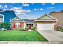 Charming single-story home with stone accents, red shutters, a well-manicured lawn, and solar panels at 1286 Culbertson Ave., Myrtle Beach, SC 29577