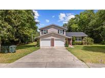 Charming two-story home with a well-maintained lawn and a two-car garage at 1720 Horry St., Conway, SC 29526