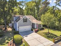 Beautiful home with a two-car garage, a large driveway, and mature trees, perfect for any Gathering at 199 Gilman Rd., Pawleys Island, SC 29585