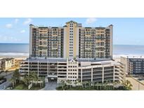 Stunning high-rise condo building with ocean views and multi-level parking at 201 S Ocean Blvd., North Myrtle Beach, SC 29582