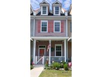 Charming two-story townhouse with a inviting front porch and colorful details at 3358 Pampas Dr., Myrtle Beach, SC 29577