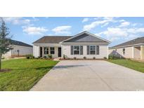 Charming single-story home with manicured lawn and a concrete driveway at 663 Culmen Ct., Myrtle Beach, SC 29588