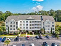 Spacious condo with parking and manicured landscaping offers a tranquil living environment at 901 Knoll Shores Ct. # 304, Murrells Inlet, SC 29576